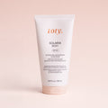 Solaria Body SPF 50 antioxidant body sunscreen, shown against a pink background